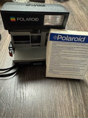 Polaroid Sun 600 with box of film